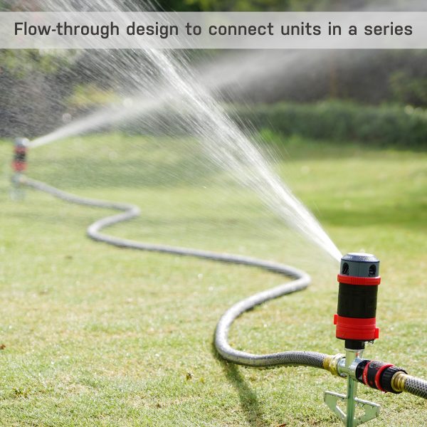 A sprinkler connected to a hose sprays water across a lawn, with text describing a flow-through design for connecting multiple units. A person in the distance.