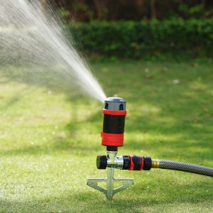 Eden 4-Pattern Rotary Gear Drive Sprinkler with Step Spike watering a large, green lawn