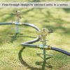 The image shows a close-up of a metal sprinkler or irrigation equipment with hoses attached, and it's positioned on a green lawn with text overlay describing a flow-through design.